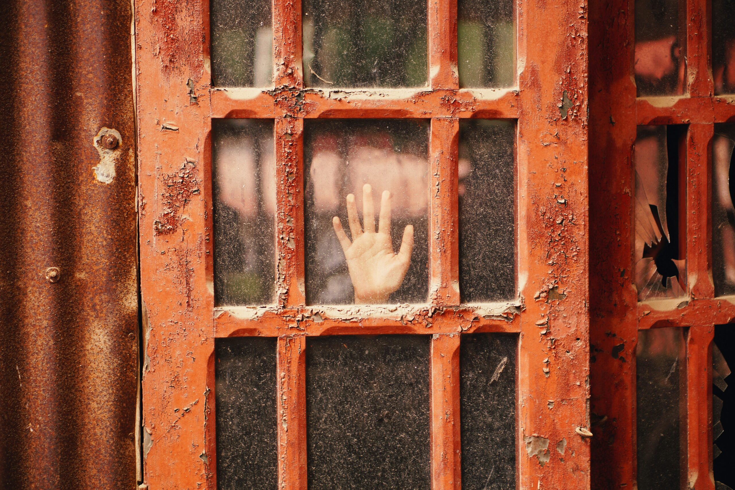 Hand reaching out from a closed door- Anshu Joshi Short Stories #3